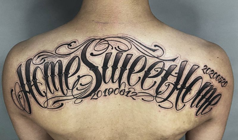 花体字纹身图片_背部花体字纹身图案