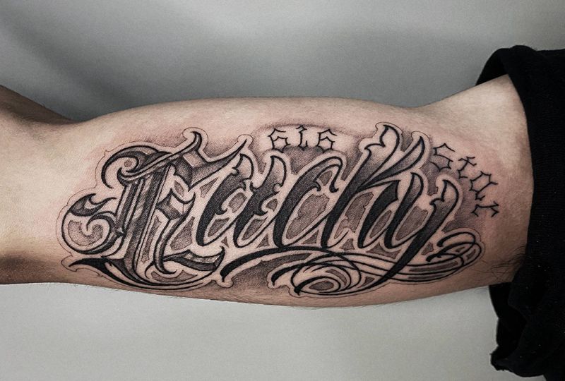 花体字纹身图片_手臂花体字纹身图案
