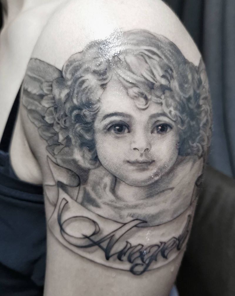 心目中的小天使纹身图片_手臂欧美写实天使写实人脸肖像纹身图案