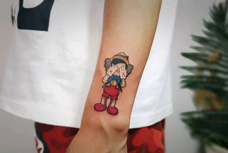 Kasw 匹诺曹纹身图片_手臂纹身图案