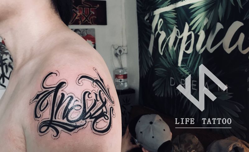 花体纹身图片_手臂花体字纹身图案