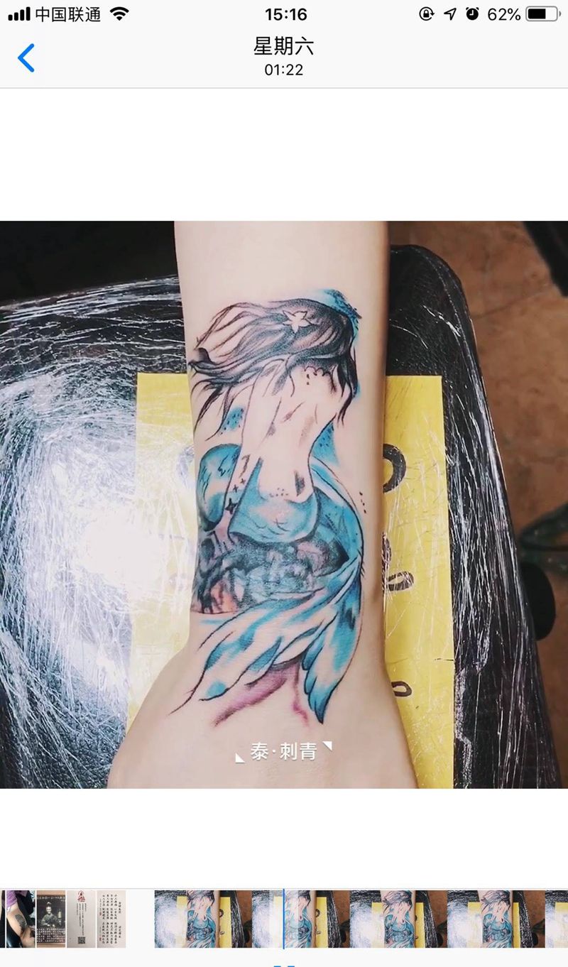 美人鱼遮盖纹身图片_手臂水彩美人鱼礁石遮盖纹身图案