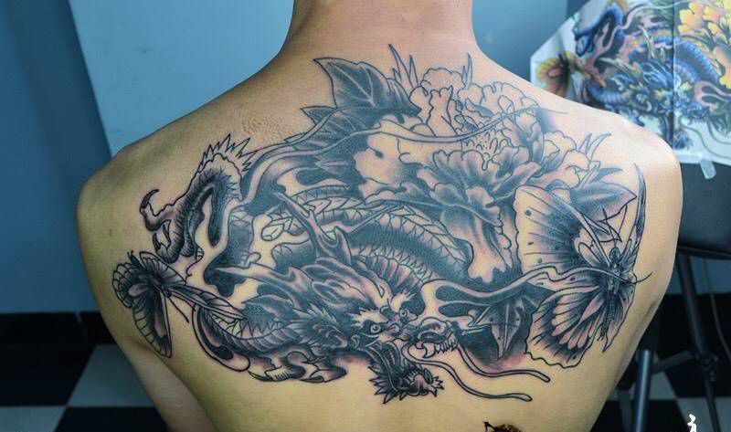 龙蝴蝶牡丹花纹身图片