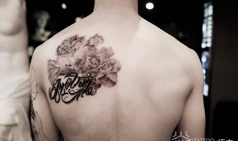 康乃馨马蹄莲花体字纹身图片