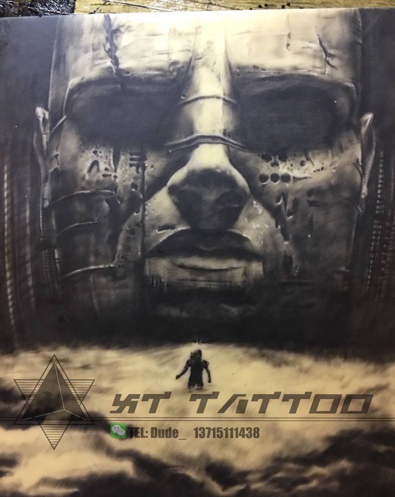 练习皮 神秘石雕头纹身图片