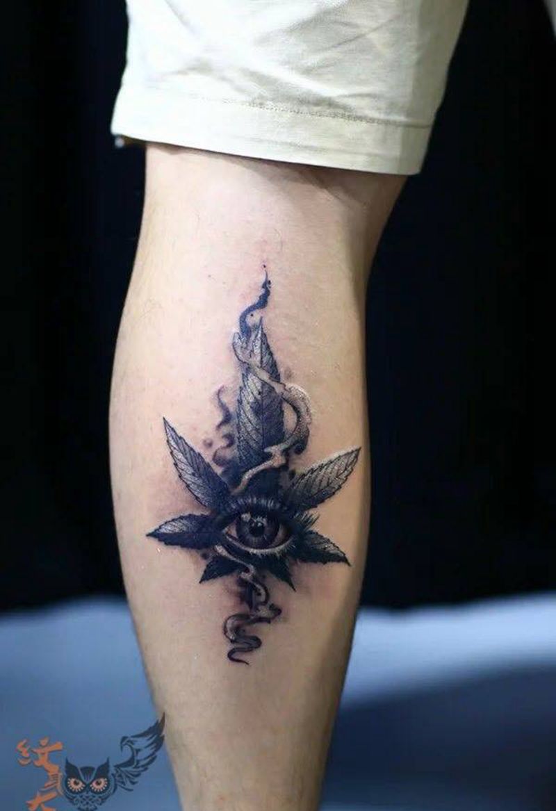 大麻叶加眼纹身图片_深圳纹身图案