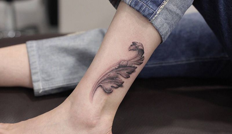 小腿唐草纹身图片_腿部欧美写实纹身图案