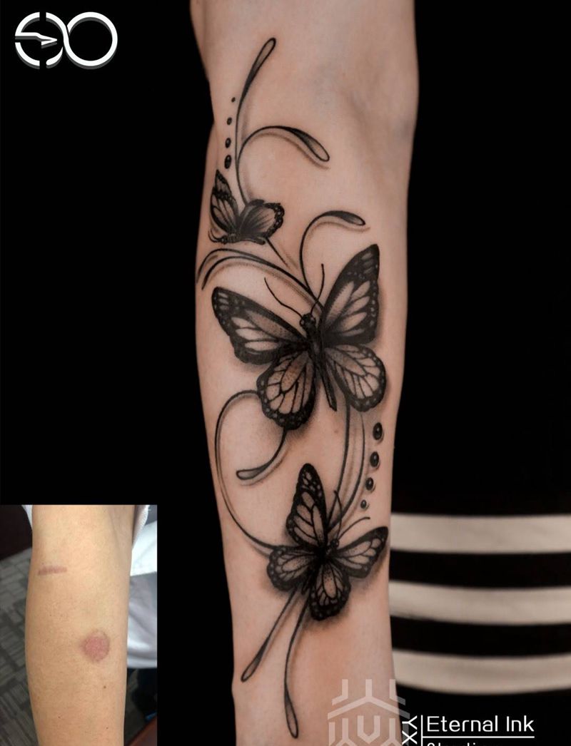 蝴蝶纹身图片_手臂点刺蝴蝶纹身图案