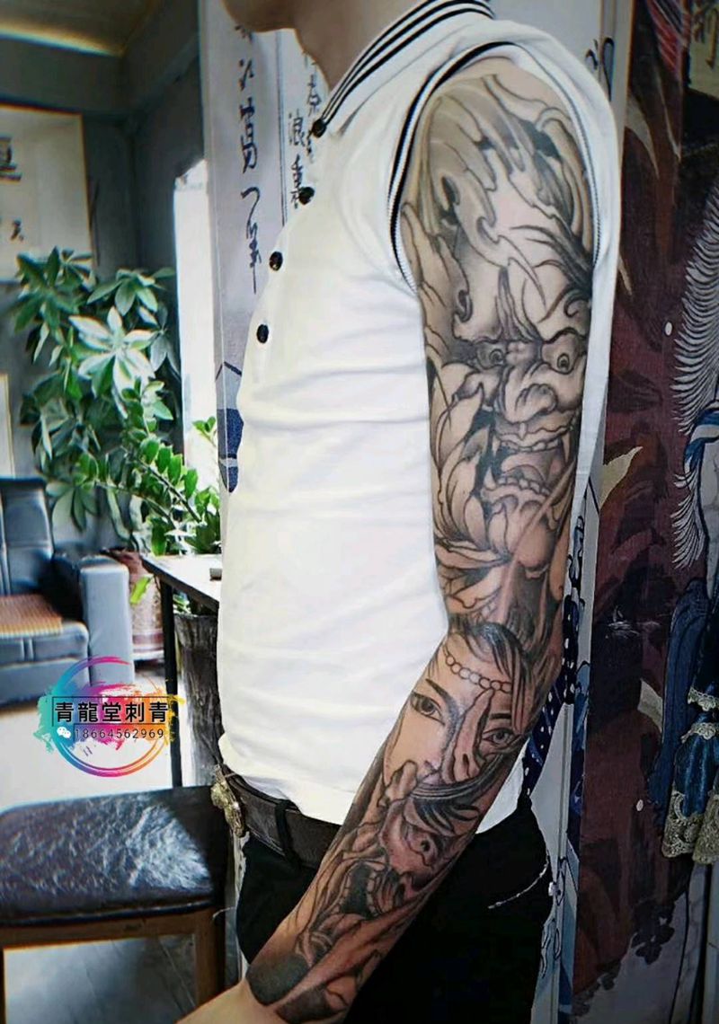 花臂未完纹身图片_手臂新传统纹身图案