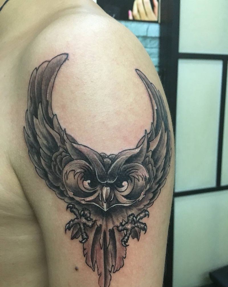 大眼怪纹身图片_成品手臂动物纹身图案