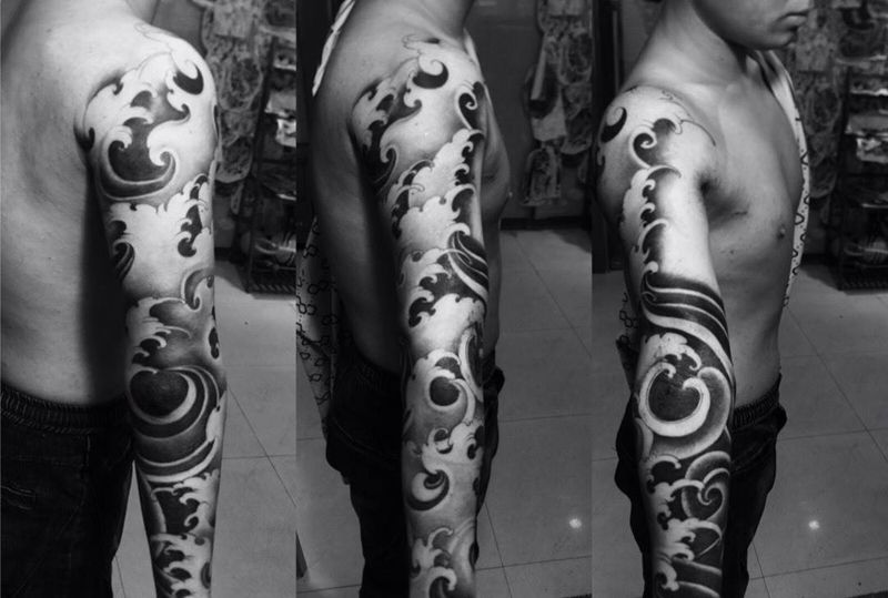 浪臂纹身图片