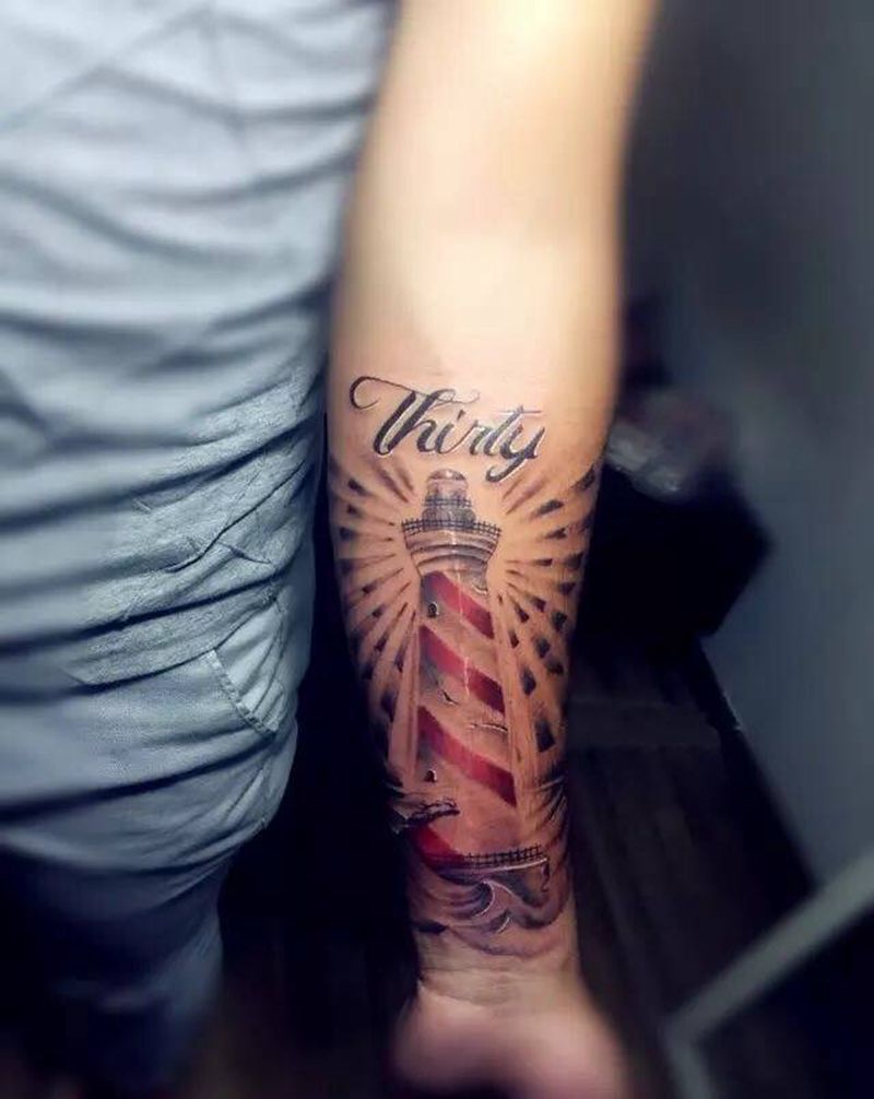 浪中灯塔纹身图片