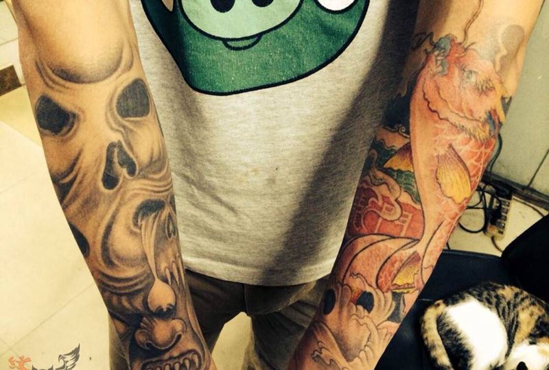 花臂纹身图片_欧美传统鬼神动物手臂纹身图案