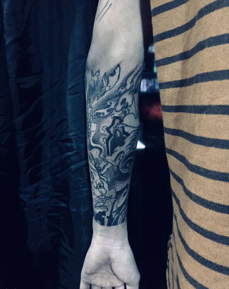 手臂打雾彩色未完纹身图片_手臂纹身图案