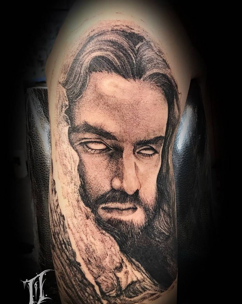 耶稣纹身图片_手臂点刺纹身图案