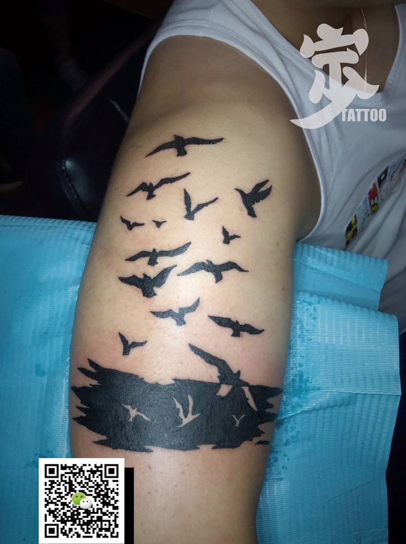 飞鸟剪影图腾纹身图片_手臂图腾纹身图案