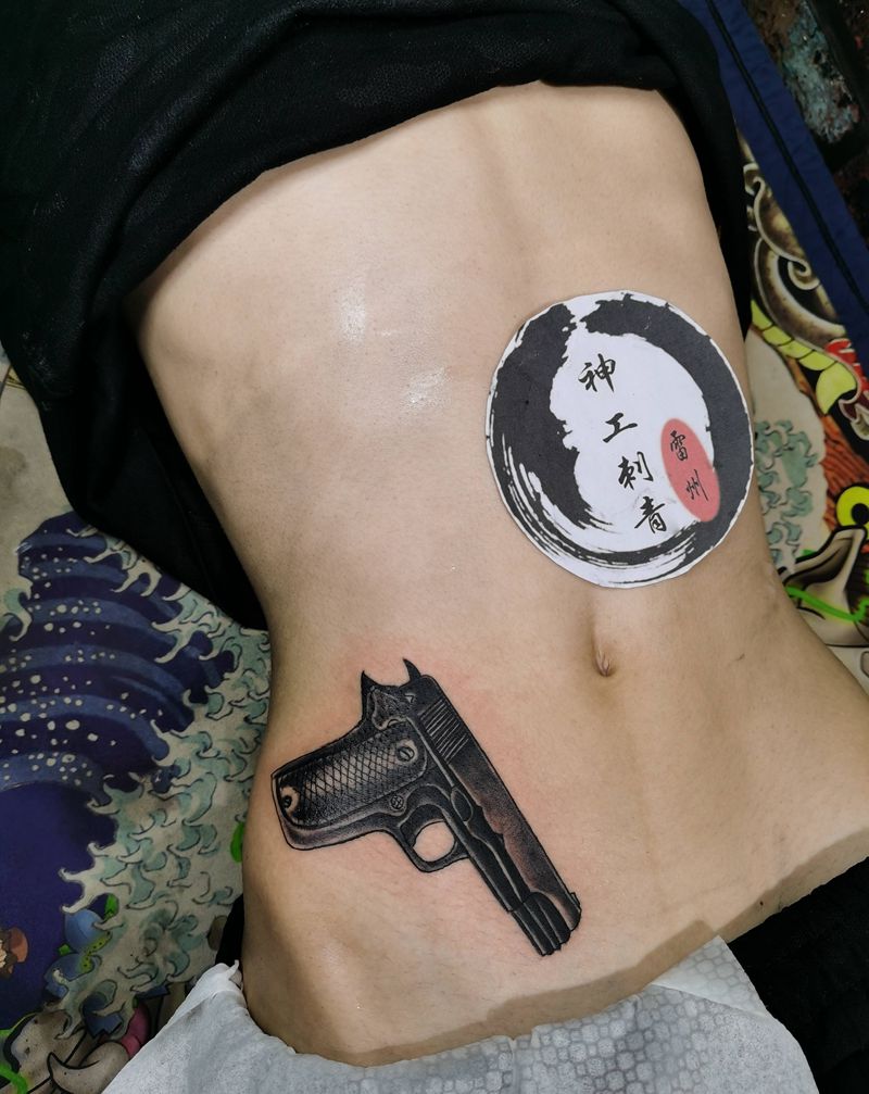 枪纹身图片_手部手臂纹身图案