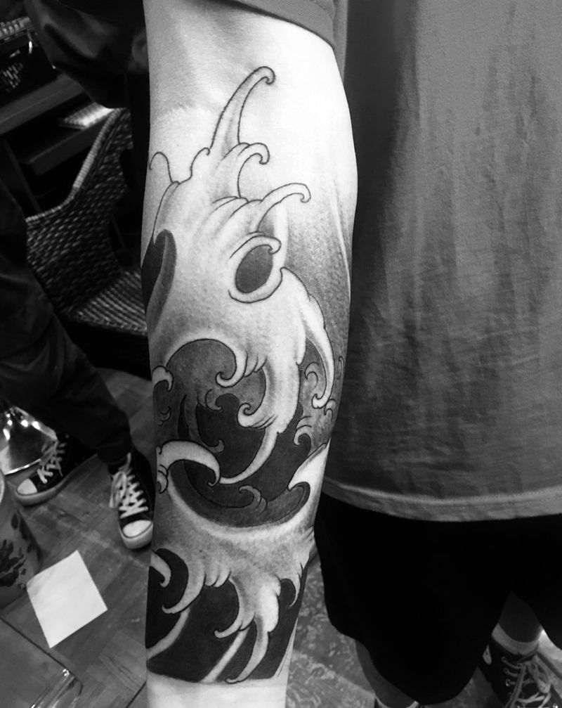 浪臂纹身图片