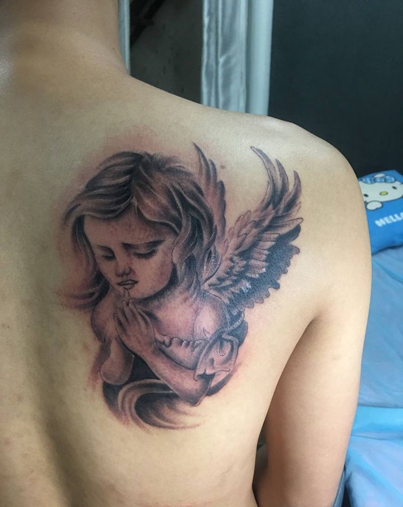 忧郁的小天使纹身图片