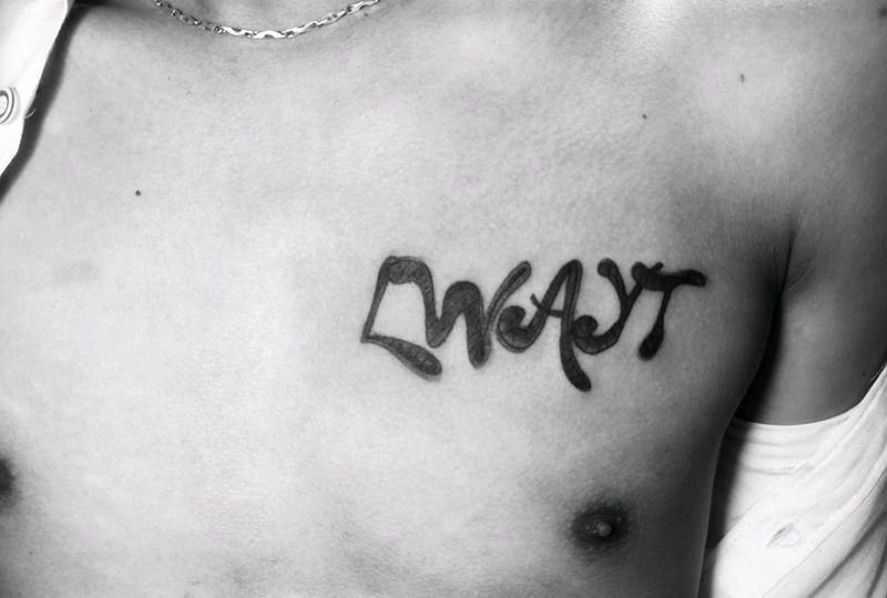 客人自己设计的花体英文。纹身图片