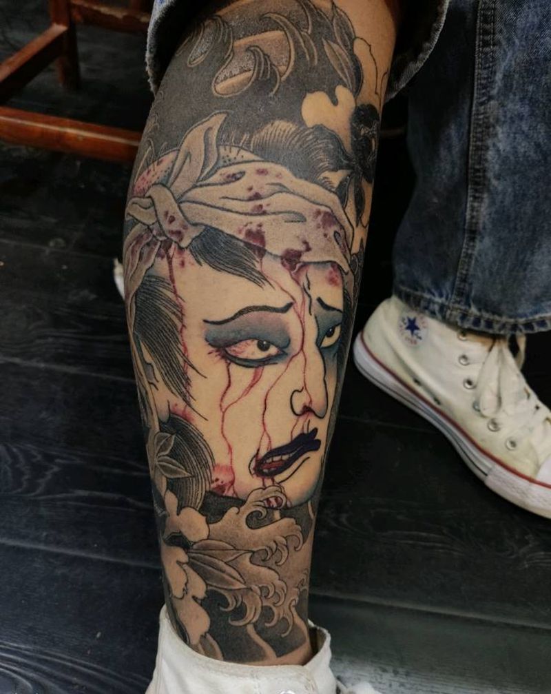 生首纹身图片_腿部老传统生首纹身图案