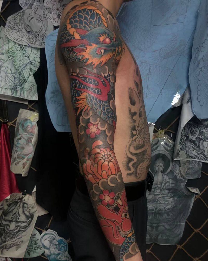 花臂龙.纹身图片_手臂老传统龙，樱花纹身图案