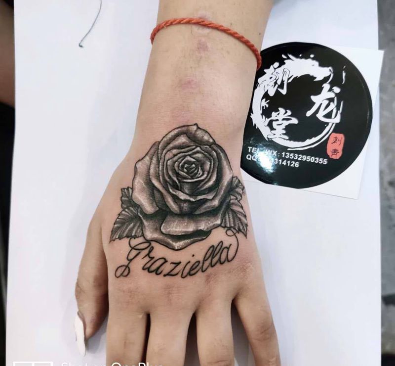 玫瑰花纹身图片_手部水墨纹身图案