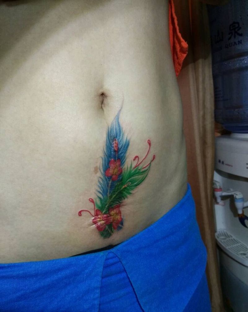 羽毛遮盖妊辰纹纹身图片_腹部传统静物成品纹身图案