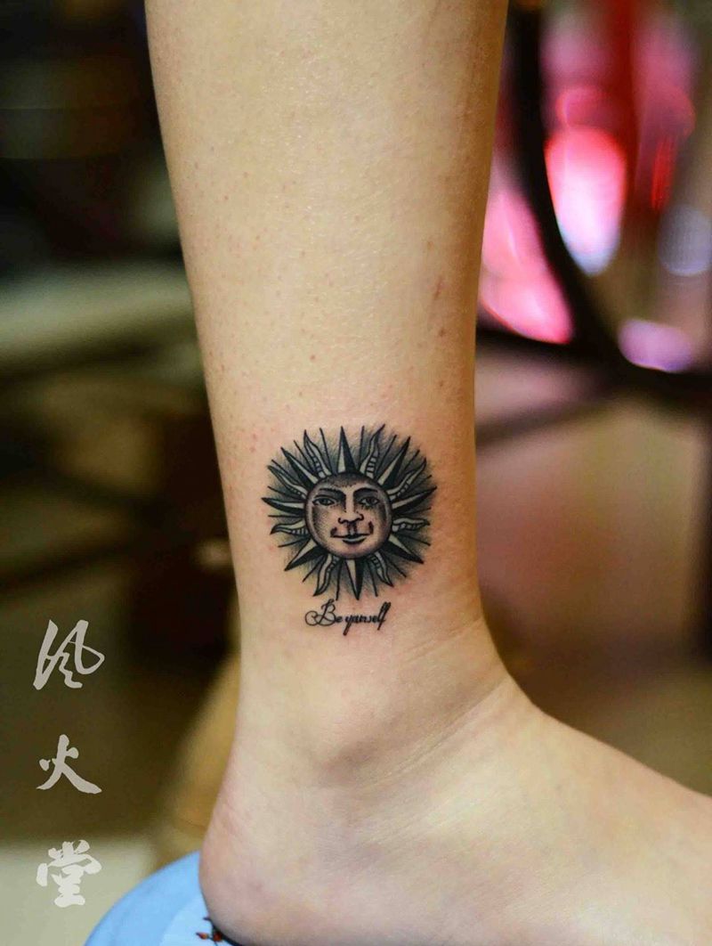 太阳纹身纹身图片_成品脚部清新鬼神纹身图案