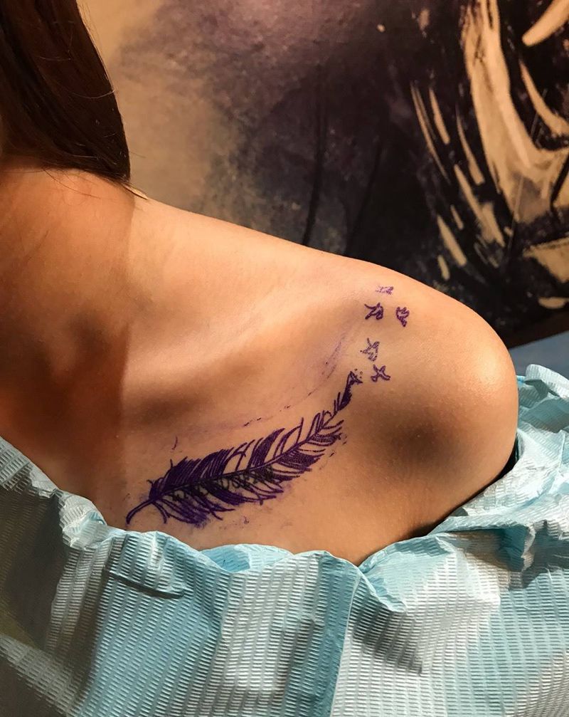 羽毛遮盖纹身图片