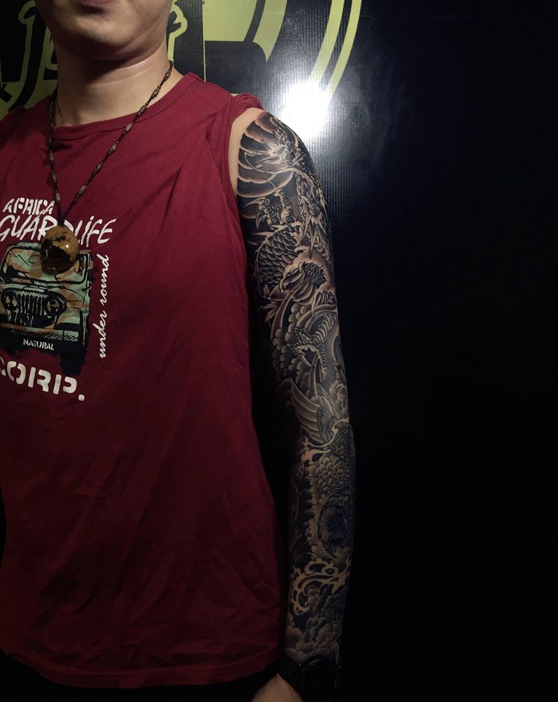 龙鹰虎纹身图片_手臂纹身图案