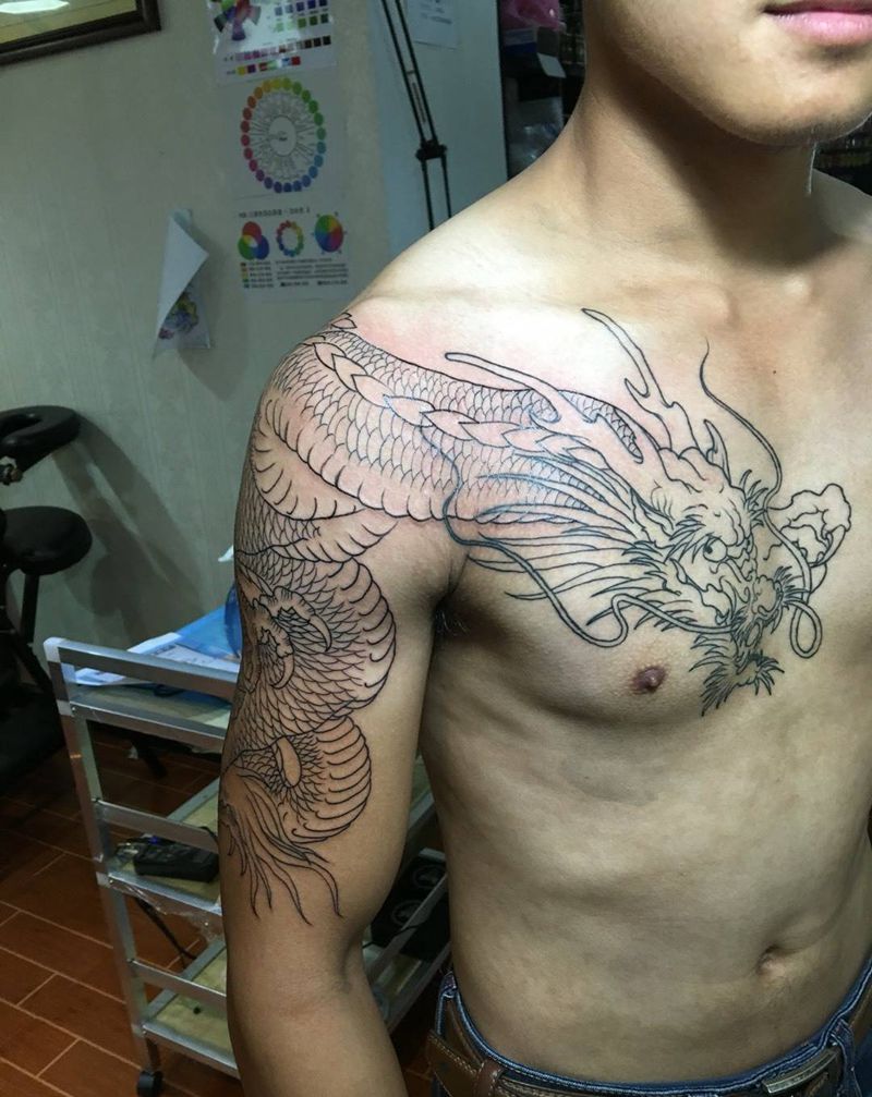 过肩龙纹身图片_胸部手臂传统动物纹身图案