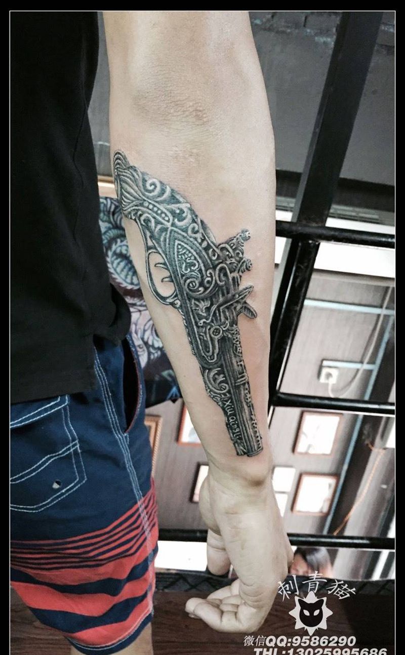 火枪纹身纹身图片_成品手臂手部欧美静物纹身图案