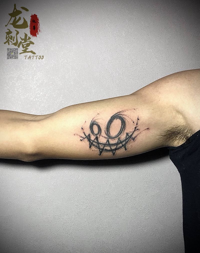 表情纹身纹身图片_手臂纹身图案