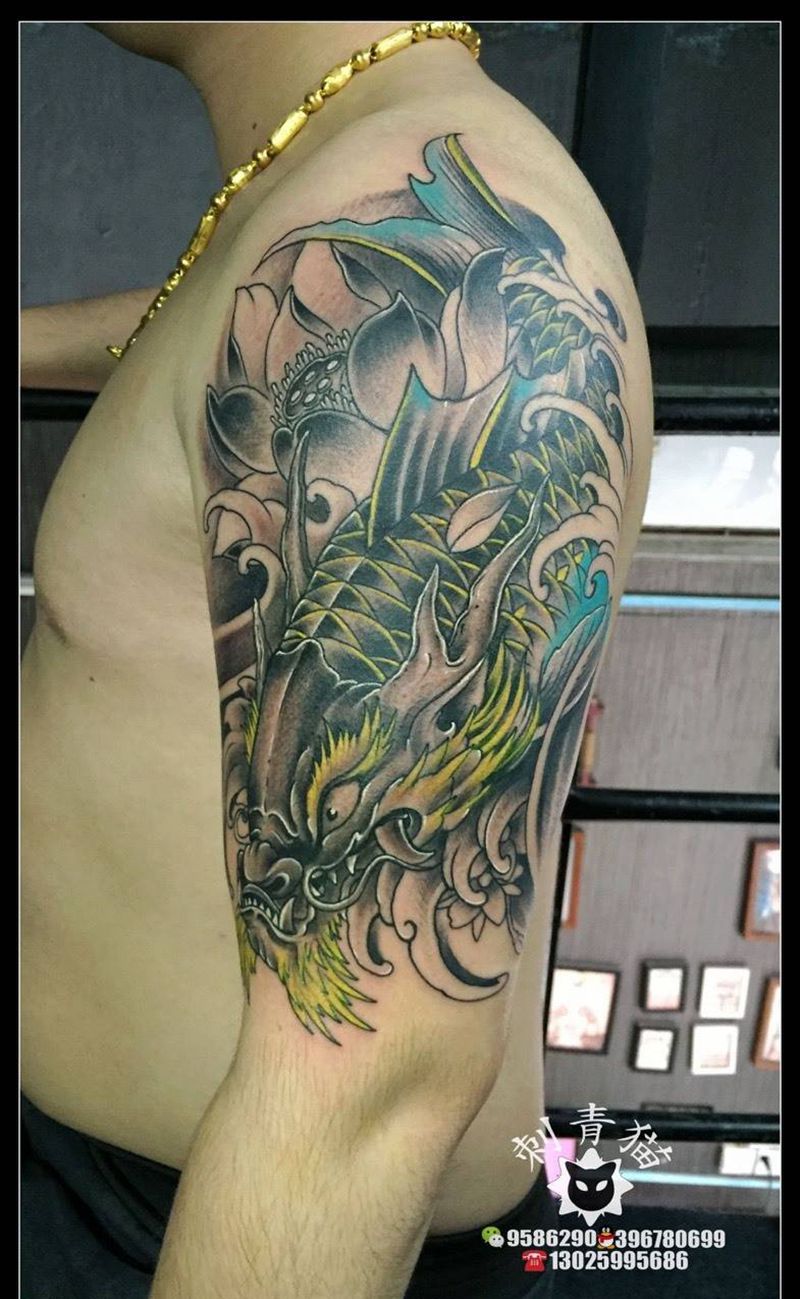鱼化龙纹身图片_成品手臂手部传统动物纹身图案