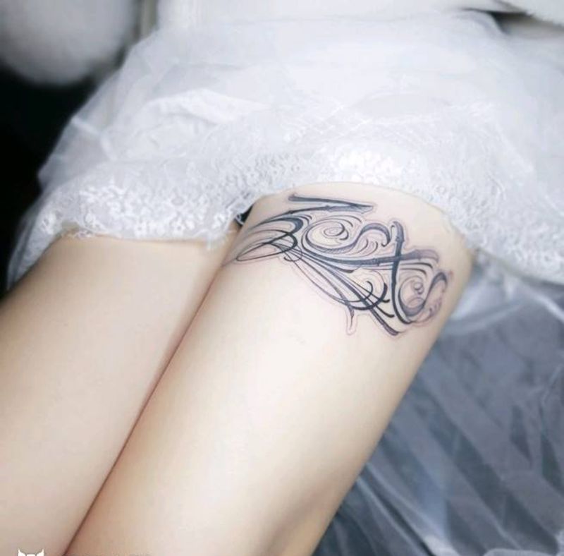 花体英文纹身图片_腿部花体字纹身图案