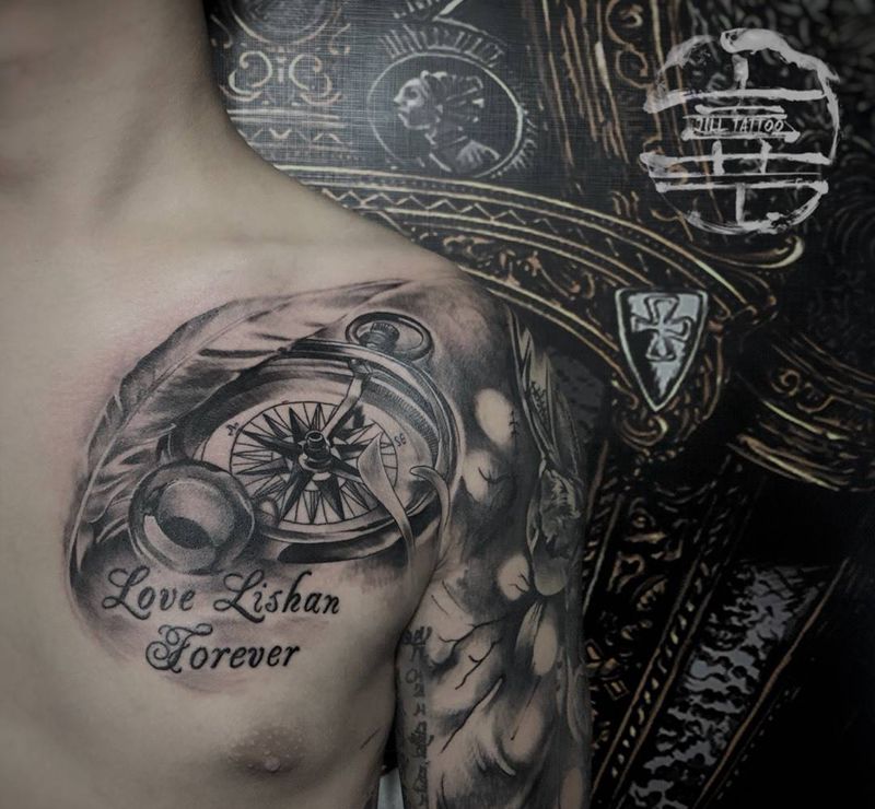 羽毛指南针纹身图片