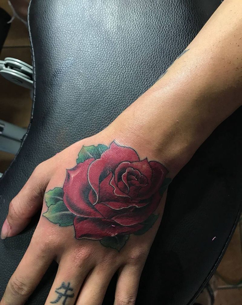 花纹身图片_手部习俗欧美羽毛静物玫瑰花纹身图案