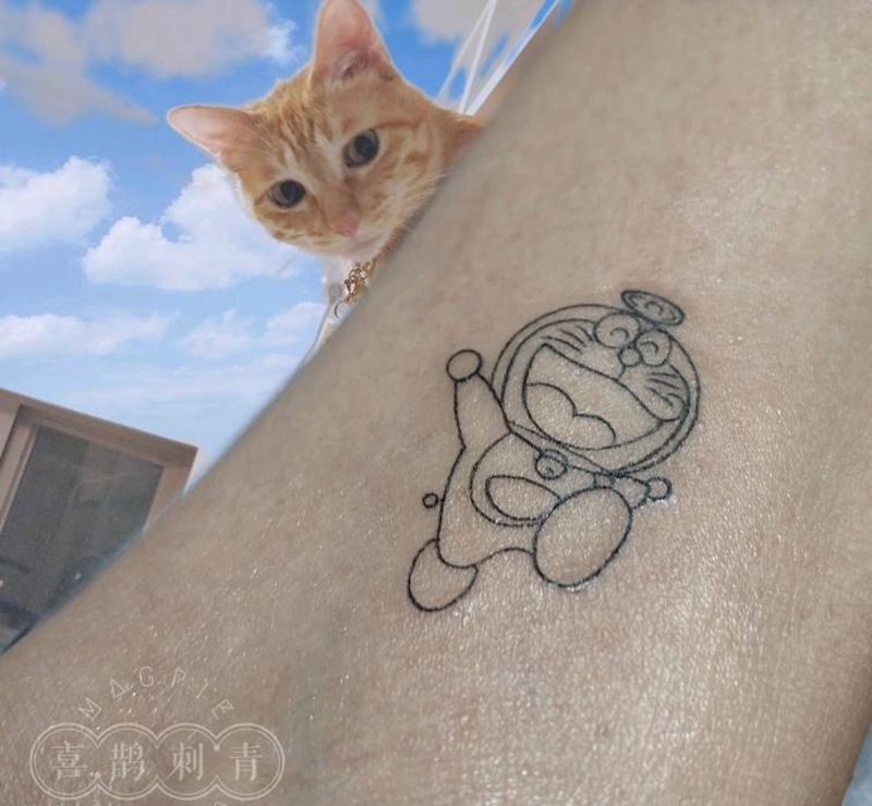 叮当猫纹身图片_手臂纹身图案
