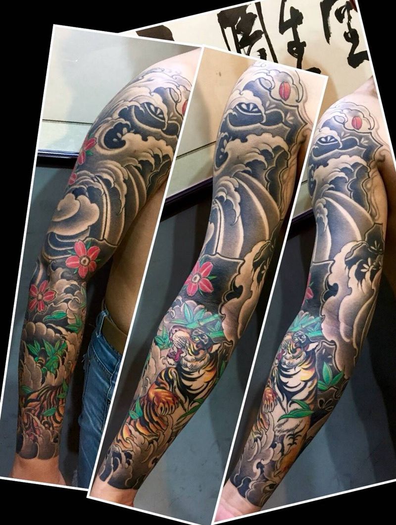 老虎浪花花臂纹身纹身图片_传统手臂重庆纹身图案