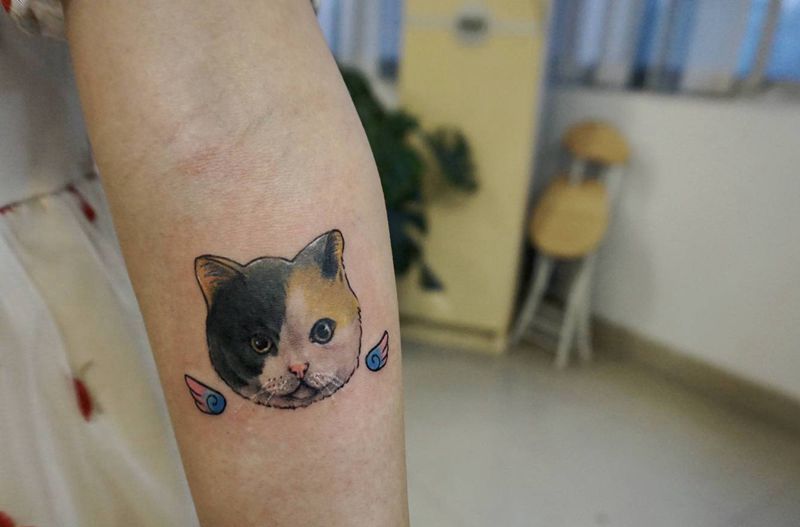 猫咪纹身图片_手臂水彩猫纹身图案