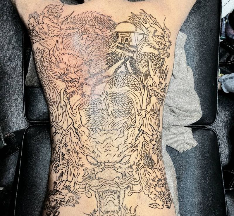 九龙拉棺纹身图片