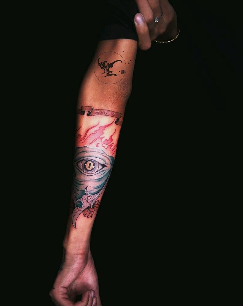 上帝之眼纹身图片_手臂欧美字符鬼神原创火焰成品纹身图案