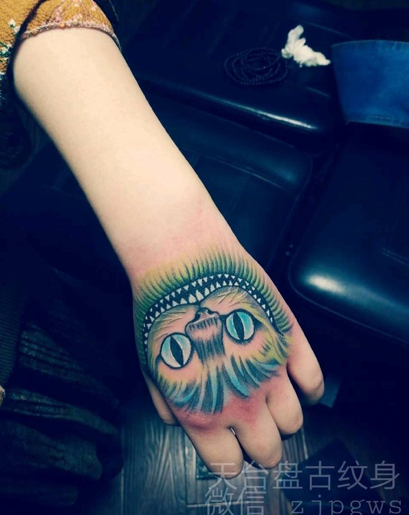 财郡猫纹身图片_手臂手部传统天台盘古天台盘古盘古成品纹身图案