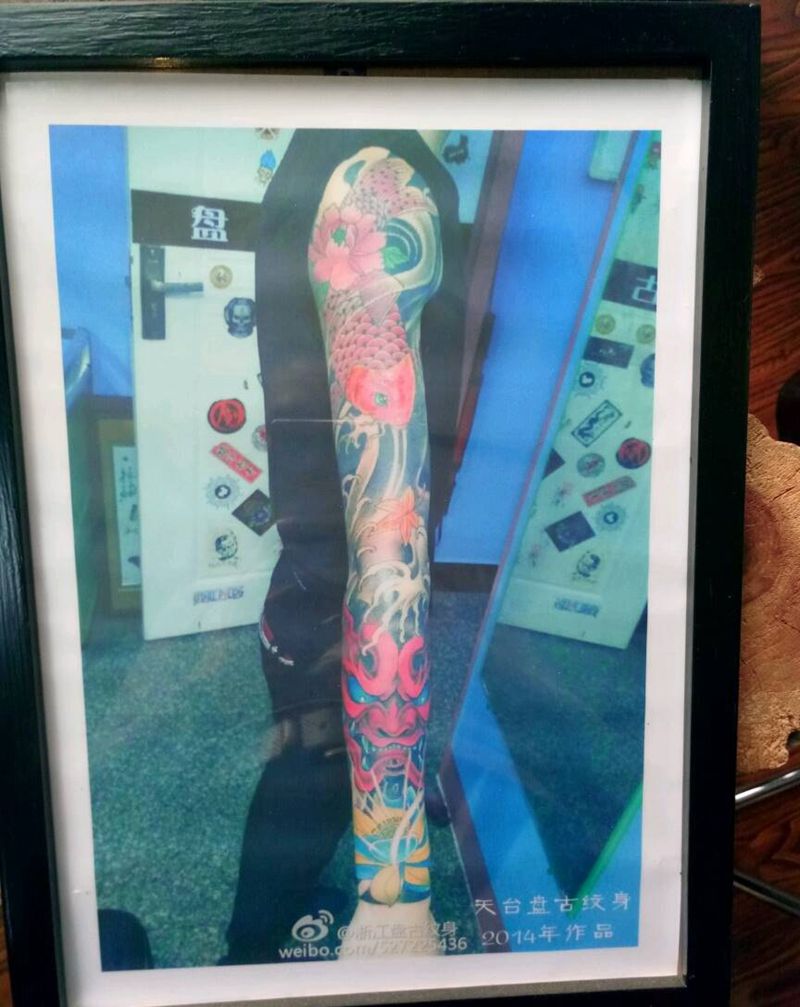 花臂纹身图片_手臂手部传统天台盘古成品纹身图案