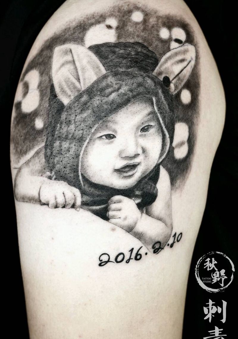 大臂肖像纹身图片