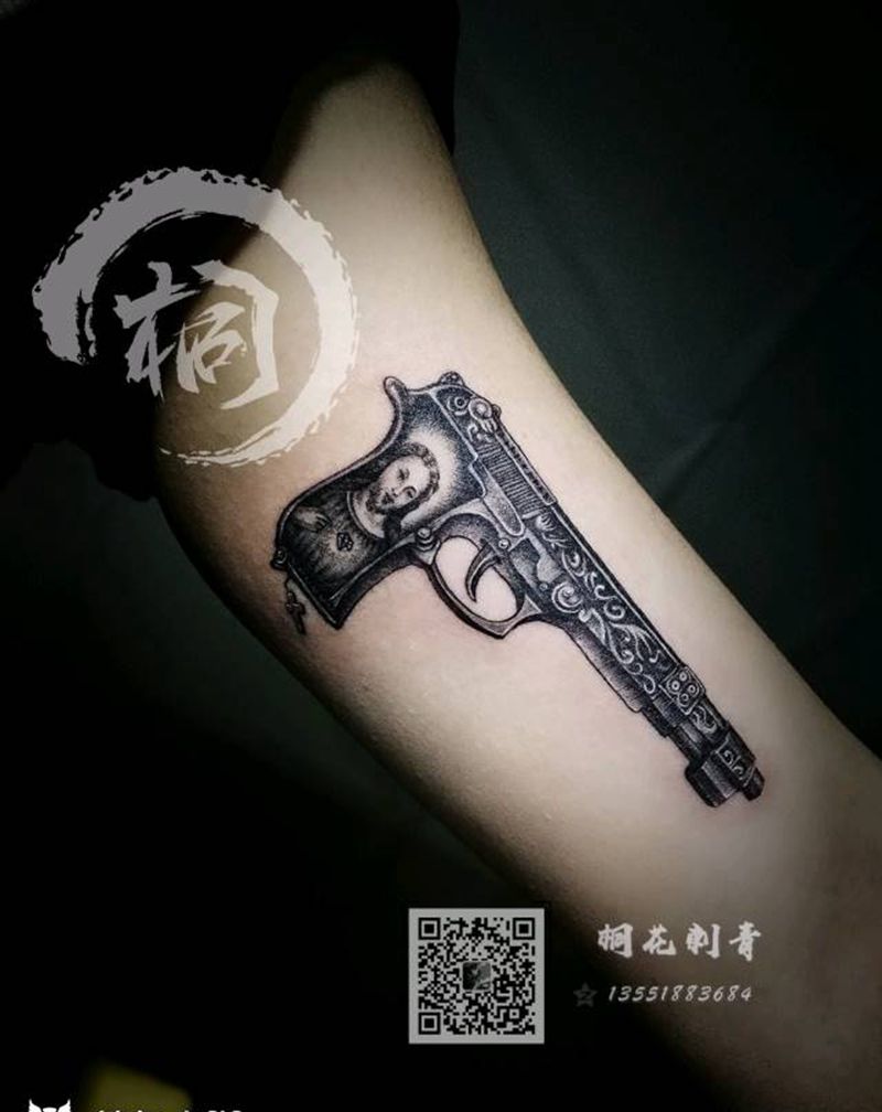 单针手枪纹身图片