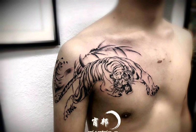 未完待续纹身图片_胸部手臂水墨纹身图案