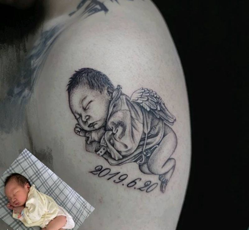 婴儿纹身图片_手臂欧美写实纹身图案