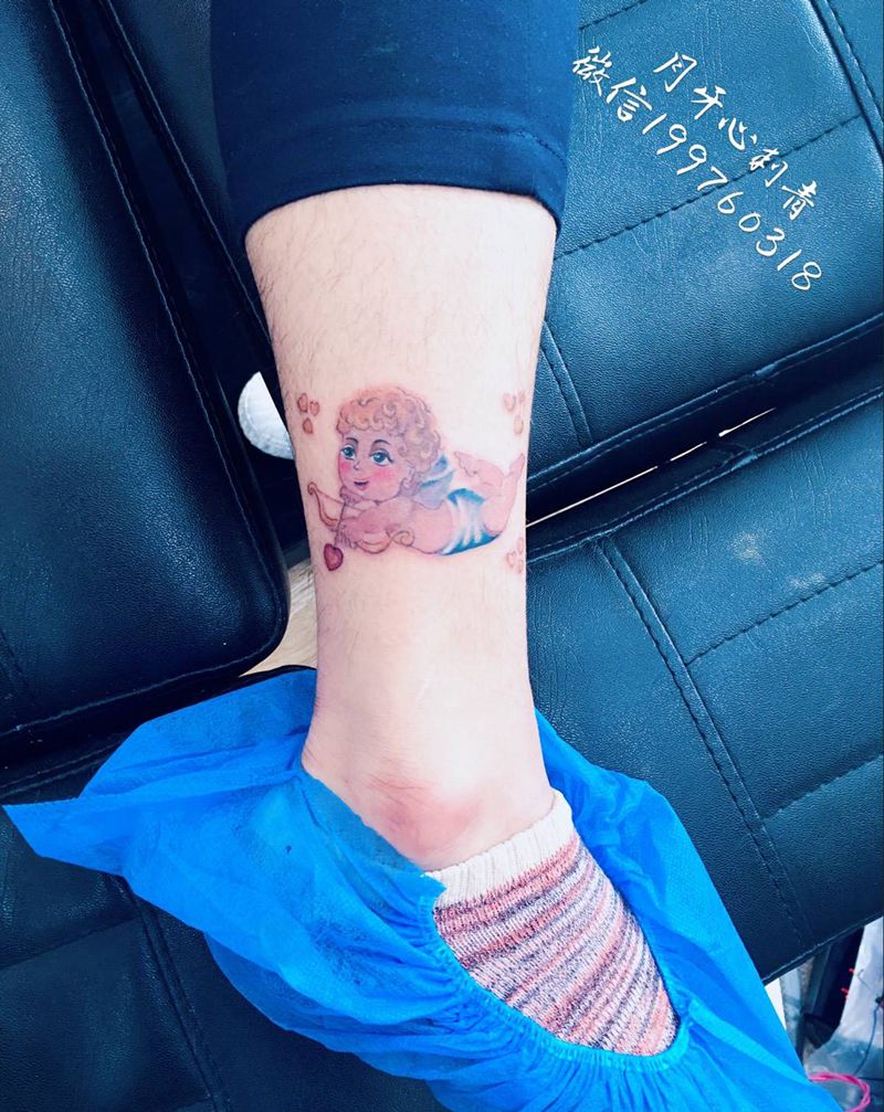 丘比特纹身图片_成品脚部腿部清新习俗人物宗教爱神脚踝箭纹身图案